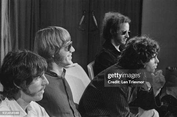 American psychedelic rock band The Doors during a press conference at Heathrow Airport, London ; drummer John Densmore, keyboard player Ray Manzarek...