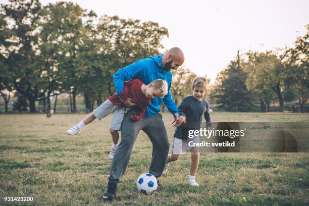 always care on eachother - father and son park stock pictures, royalty-free photos & images