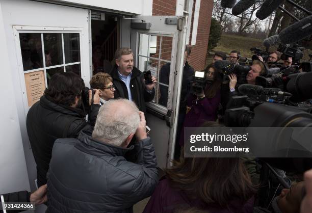 Rick Saccone, Republican candidate for the U.S. House of Representatives, is surrounded by members of the media after voting at the Mount Vernon...