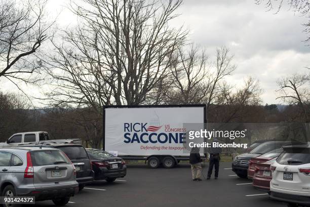 Campaign sign for Rick Saccone, Republican candidate for the U.S. House of Representatives, is displayed in the parking lot outside the Mount Vernon...