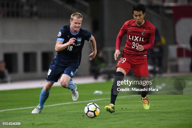 Matthew Simon of Sydney FC and Tomoya Inukai of Kashima Antlers compete for the ball during the AFC Champions League Group H match between Kashima...