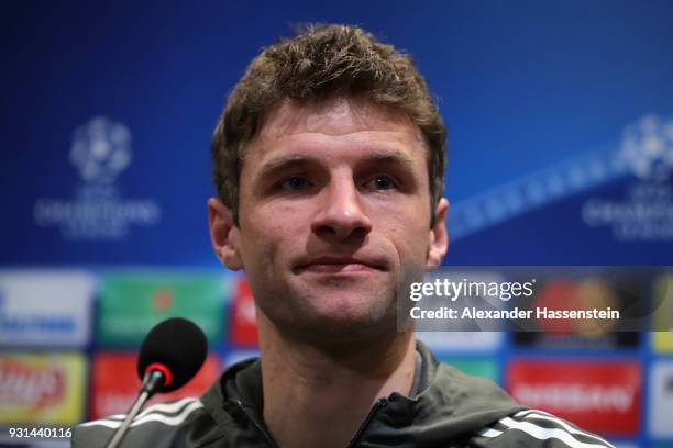 Thomas Mueller of Bayern Muenchen speaks during a Bayern Muenchen training session and press conference ahead of their UEFA Champions League round of...