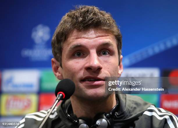 Thomas Mueller of Bayern Muenchen speaks during a Bayern Muenchen training session and press conference ahead of their UEFA Champions League round of...