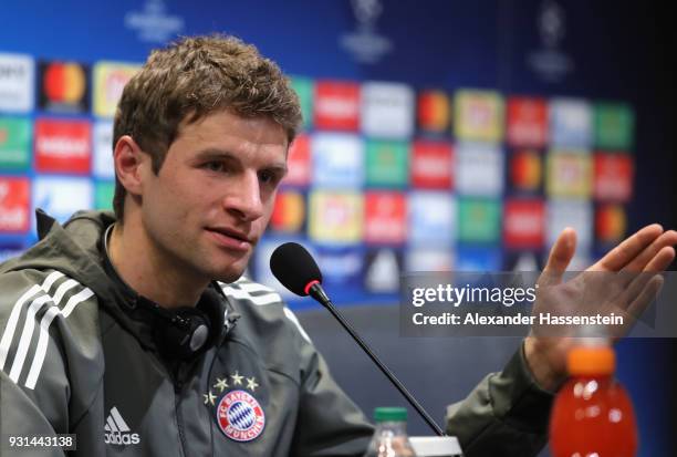 Thomas Mueller of Bayern Muenchen speaks during a Bayern Muenchen training session and press conference ahead of their UEFA Champions League round of...