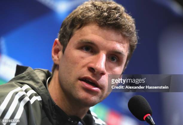 Thomas Mueller of Bayern Muenchen speaks during a Bayern Muenchen training session and press conference ahead of their UEFA Champions League round of...