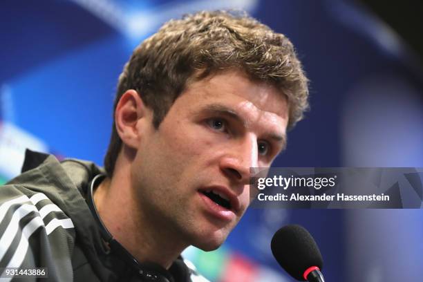 Thomas Mueller of Bayern Muenchen speaks during a Bayern Muenchen training session and press conference ahead of their UEFA Champions League round of...