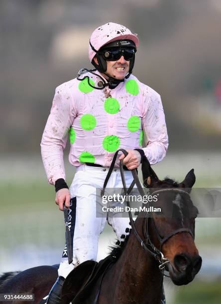 Benie Des Dieux ridden by Ruby Walsh celebrates winning the Mares' Hurdle on Champion Day of the Cheltenham Festival at Cheltenham Racecourse on...