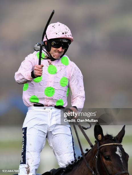 Benie Des Dieux ridden by Ruby Walsh celebrates winning the Mares' Hurdle on Champion Day of the Cheltenham Festival at Cheltenham Racecourse on...