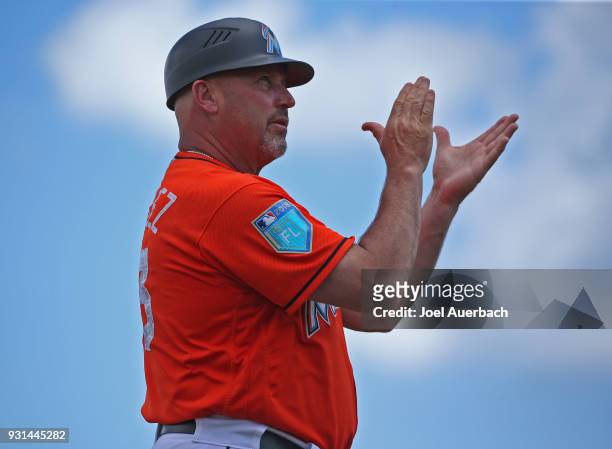 Third base coach Fredi Gonzalez of the Miami Marlins reacts to second inning action against the New York Yankees during a spring training game at...