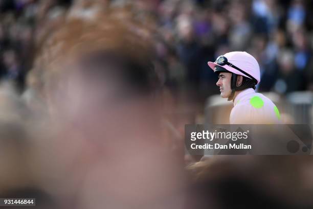 Benie Des Dieux ridden by Ruby Walsh celebrates winning the Mares' Hurdle on Champion Day of the Cheltenham Festival at Cheltenham Racecourse on...