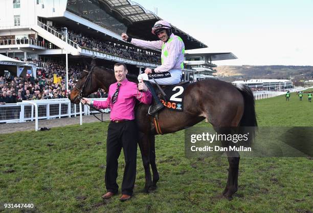Benie Des Dieux ridden by Ruby Walsh celebrates winning the Mares' Hurdle on Champion Day of the Cheltenham Festival at Cheltenham Racecourse on...