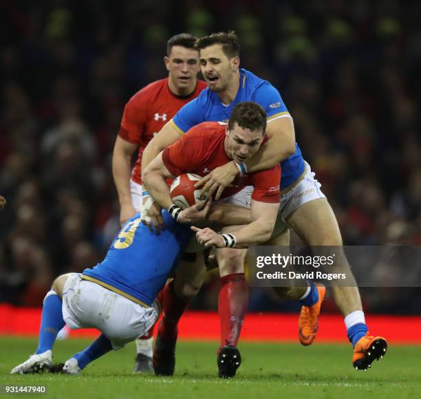 George North of Wales is tackled by Mattia Belllini and Marcelo Violi during the NatWest Six Nations match between Wales and Italy at the...