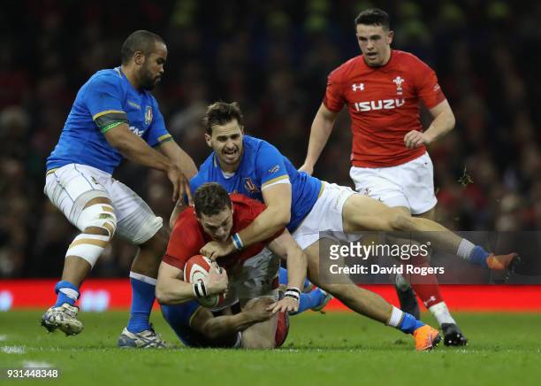 George North of Wales is tackled by Mattia Belllini during the NatWest Six Nations match between Wales and Italy at the Principality Stadium on March...