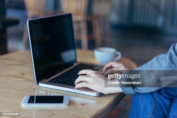 using laptop computer and smart phone - computer screen over shoulder stock pictures, royalty-free photos & images