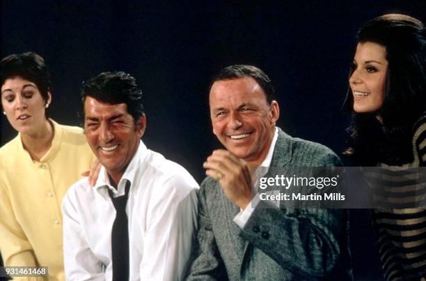 Deana Martin, Dean Martin , Frank Sinatra and Tina Sinatra sing on stage during the taping of 'The Dean Martin, Frank Sinatra Christmas Special'...