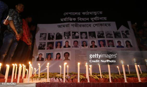 People hold a candlelight vigil at Cenral Shaheed Minar on Tuesday in memory of Kathmandu plane crash victims. Cross section of people and Nepali...