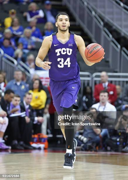 Horned Frogs guard Kenrich Williams brings the ball upcourt in the second half of a quarterfinal game in the Big 12 Basketball Championship between...