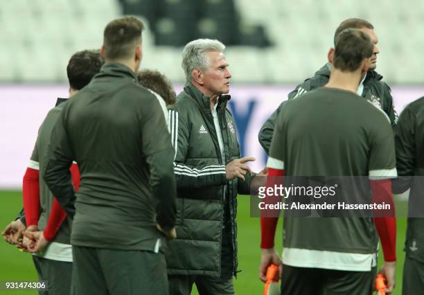 Jupp Heynckes manager of Beyern Muenchen speaks with his players during a Bayern Muenchen training session ahead of their UEFA Champions League round...