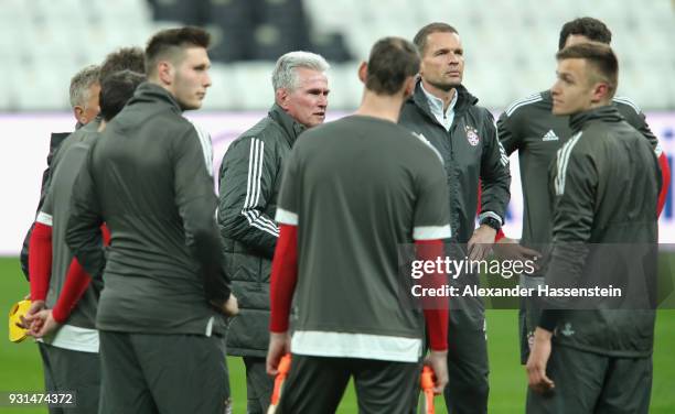 Jupp Heynckes manager of Beyern Muenchen speaks with his players during a Bayern Muenchen training session ahead of their UEFA Champions League round...