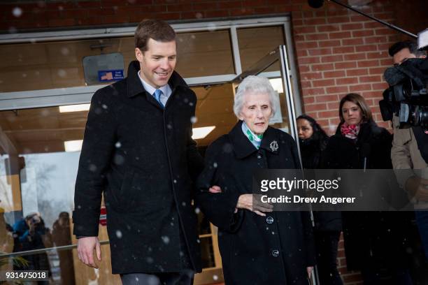 Conor Lamb, Democratic congressional candidate for Pennsylvania's 18th district, and his grandmother Barbara Lamb exit the polling station after she...