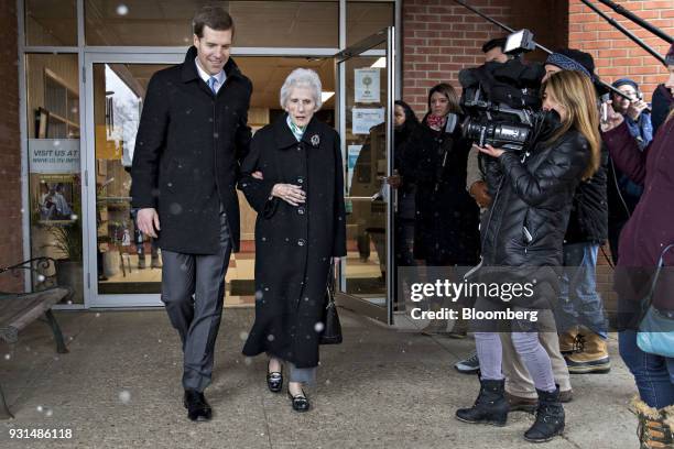 Conor Lamb, Democratic candidate for the U.S. House of Representatives, walks with his grandmother Barbara Lamb after voting at the Our Lady of...