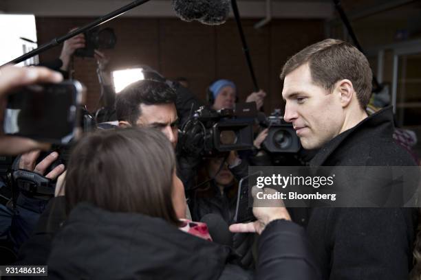 Conor Lamb, Democratic candidate for the U.S. House of Representatives, speaks to members of the media at the Our Lady of Victory Church polling...
