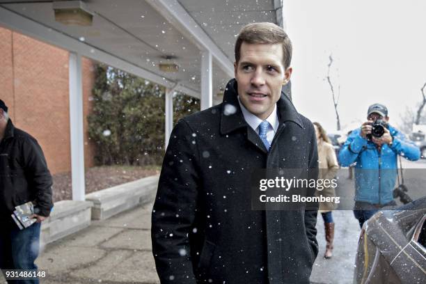 Conor Lamb, Democratic candidate for the U.S. House of Representatives, walks to his vehicle outside the Our Lady of Victory Church polling location...