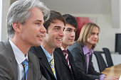 four men at a seminar