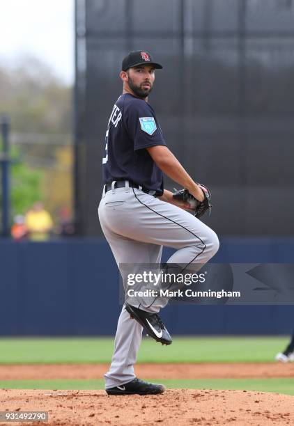 Ryan Carpenter of the Detroit Tigers pitches while wearing a special SD logo baseball hat to honor the Marjory Stoneman Douglas High School shooting...