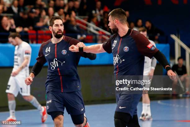 Nikola Karabatic of Paris Saint Germain is celebrating a goal with Luka Karabatic of Paris Saint Germain during the Champions League match between...