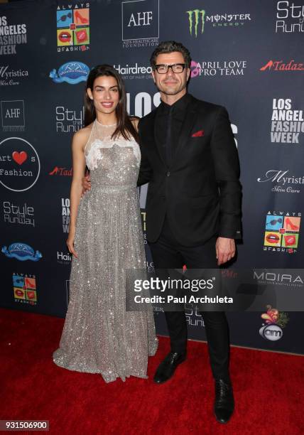 Actors Tonia Sotiropoulou and Christos Vasilopoulos attend the Domingo Zapata Fashion Show at the Los Angeles Fashion Week 10th season anniversary at...