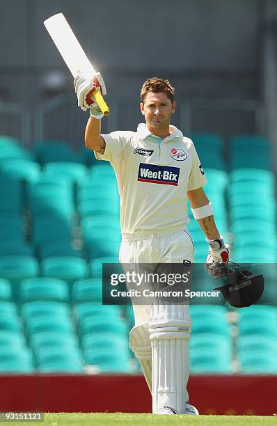 Michael Clarke of the Blues celebrates scoring a century during day two of the Sheffield Shield match between the New South Wales Blues and the...