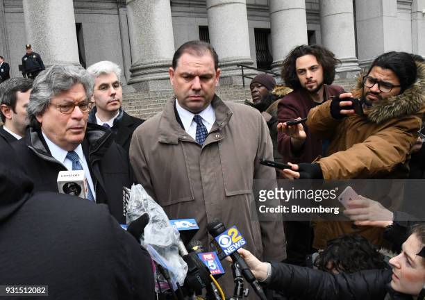 Joseph Percoco, a former top aide to Governor Andrew Cuomo, center, exits federal court with his attorney Barry Bohrer, left, in New York, U.S., on...