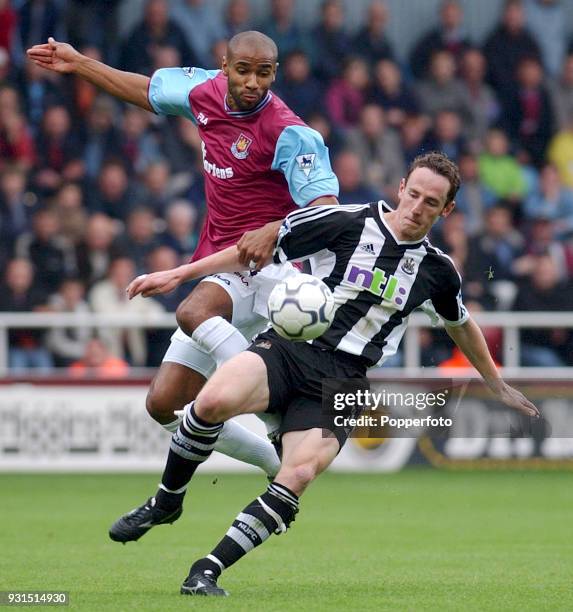Frederic Kanoute of West Ham United and Andy O'Brien of Newcastle United in action during the FA Barclaycard Premiership match between West Ham...