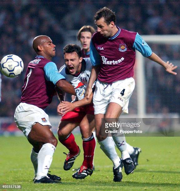 Steed Malbranque of Fulham is halted by Trevor Sinclair and Don Hutchison of West Ham United during the FA Barclaycard Premiership match between West...