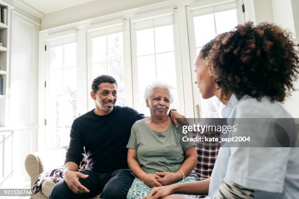 assisting care at home - ethiopian ethnicity stock pictures, royalty-free photos & images