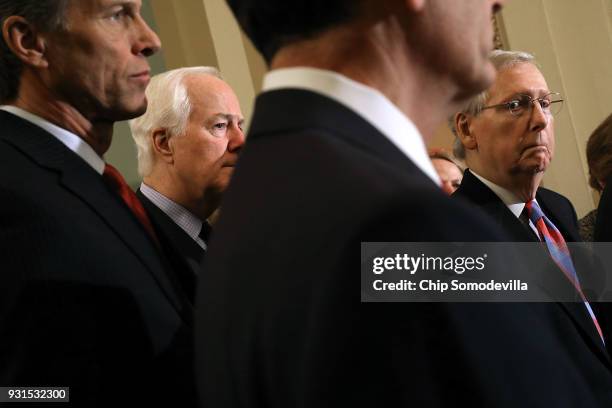 Senate Majority Leader Mitch McConnell , Sen. John Thune and Majority Whip John Cornyn talk to reporters following the regular Republican policy...