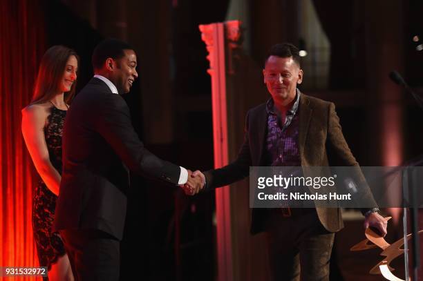 Editor in Chief of GQ Jim Nelson accepts an award from Don Lemon onstage during the Ellie Awards 2018 on March 13, 2018 in New York City.