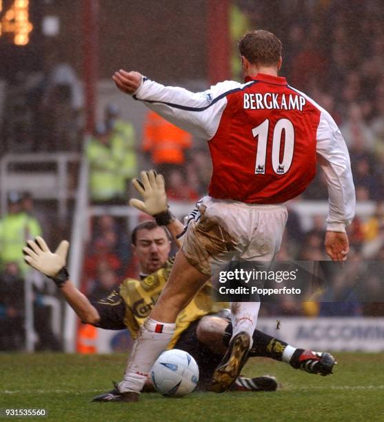 Dennis Bergkamp of Arsenal is denied by Jerzy Dudek of Liverpool during the AXA Sponsored FA Cup fourth round match at Highbury in London on January...