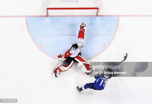 Jocelyne Lamoureux of the United States scores a goal against Shannon Szabados of Canada in a shootout to win the Women's Gold Medal Game on day...