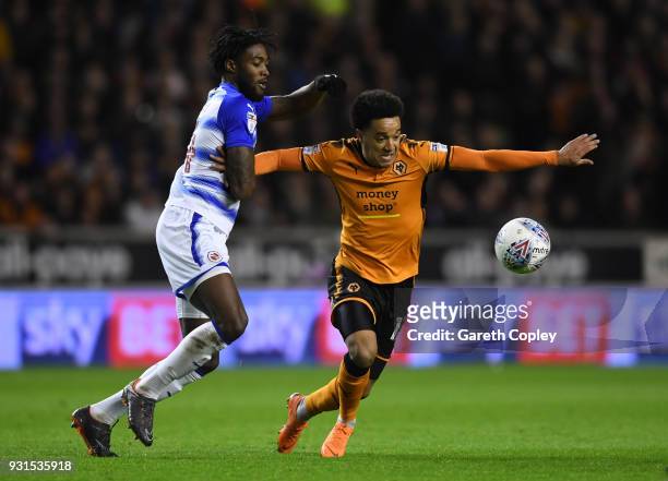 Helder Costa of Wolverhampton Wanders gets to the ball ahead of Tyler Blackett and George Evans of Reading during the Sky Bet Championship match...