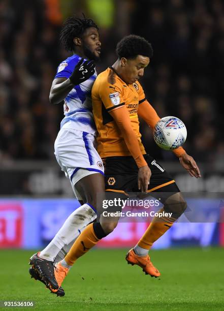 Helder Costa of Wolverhampton Wanders gets to the ball ahead of Tyler Blackett and George Evans of Reading during the Sky Bet Championship match...