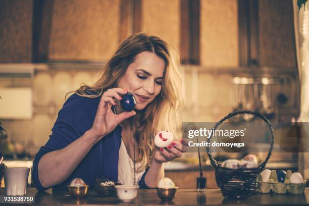 beautiful woman decorating easter eggs with decoupage technique for holidays - decoupage stock pictures, royalty-free photos & images