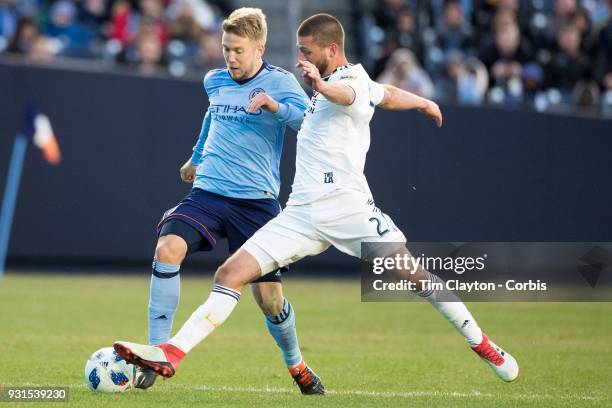 March 11: Anton Tinnerholm of New York City challenged by Perry Kitchen of Los Angeles Galaxy during the New York City FC Vs LA Galaxy regular season...