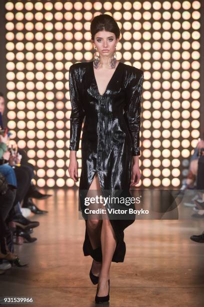 Model walks the runway during the Beso Tura fashion show at Mercedes Benz Fashion Week Russia Fall/Winter 2018/19 at Flacon Factory on March 12, 2018...