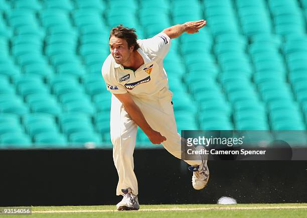 Tim MacDonald of the Tigers bowls during day two of the Sheffield Shield match between the New South Wales Blues and the Tasmanian Tigers at Sydney...