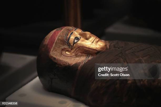 Coffin lid from Egypt with a gilded mask is displayed at the Field Museum on March 13, 2018 in Chicago, Illinois. The artifact is part of the new...