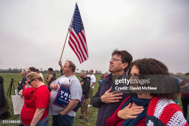 Supporters of U.S. President Donald Trump rally for the president during his visit to see the controversial border wall prototypes on March 13, 2018...