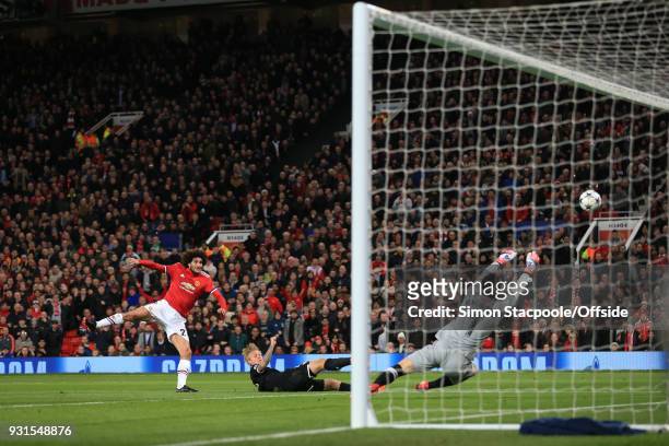 Sevilla goalkeeper Sergio Rico saves an effort from Marouane Fellaini of Man Utd during the UEFA Champions League Round of 16 Second Leg match...