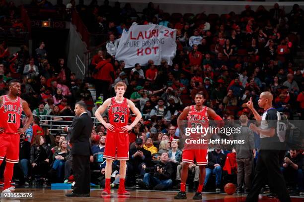 Lauri Markkanen and Kris Dunn of the Chicago Bulls look on during the game against the Boston Celtics on March 5, 2018 at the United Center in...